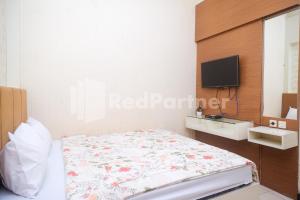 Letto o letti in una camera di Tatti Inn Syariah Seturan RedPartner