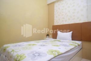 Letto o letti in una camera di Tatti Inn Syariah Seturan RedPartner