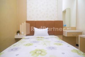 Letto o letti in una camera di Tatti Inn Syariah Seturan RedPartner