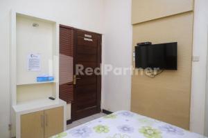 TV o dispositivi per l'intrattenimento presso Tatti Inn Syariah Seturan RedPartner