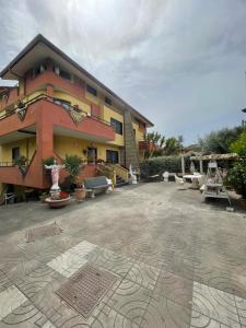a large building with a patio in front of it at B&B Villa Diamante in Scafati