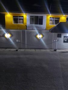 a house with lights on the side of a street at TRENDY INN HOTEL in Lagos