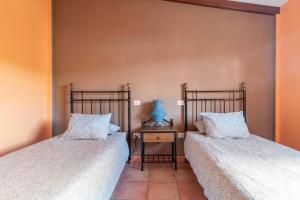 Postel nebo postele na pokoji v ubytování Villa Tijuana - Jacuzzi, Playa y Naturaleza en Gran Canaria