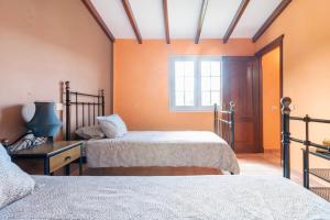 Postel nebo postele na pokoji v ubytování Villa Tijuana - Jacuzzi, Playa y Naturaleza en Gran Canaria