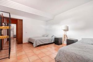 Postel nebo postele na pokoji v ubytování Villa Tijuana - Jacuzzi, Playa y Naturaleza en Gran Canaria