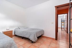 Postel nebo postele na pokoji v ubytování Villa Tijuana - Jacuzzi, Playa y Naturaleza en Gran Canaria