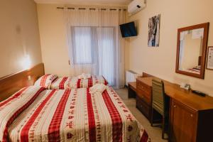 Rúm í herbergi á Hotel Nilde