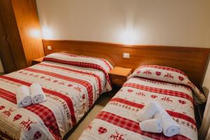 Rúm í herbergi á Hotel Nilde