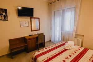 Rúm í herbergi á Hotel Nilde