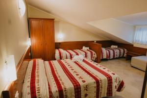 Rúm í herbergi á Hotel Nilde