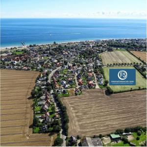 an aerial view of a city with houses and the ocean at Haus Prohl Whg1 in Dahme