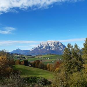 a view of a snow covered mountain in the distance at Zeit/-Los in Irdning +2 photos