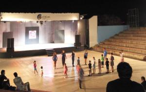 a group of people standing on a dance floor in a stage at L'Oasi di Athena in Ragusa