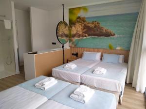 Postel nebo postele na pokoji v ubytování Alannia Salou