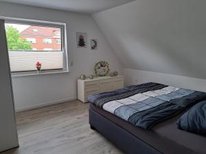Postel nebo postele na pokoji v ubytování FeWo am Obenende