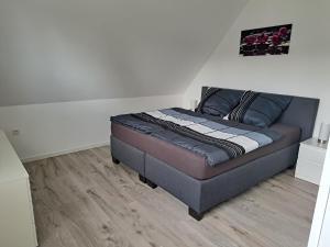 Postel nebo postele na pokoji v ubytování FeWo am Obenende