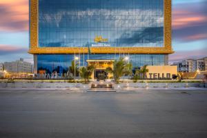 a large building with a lot of lights in front of it at Donatello Jeddah Hotel in Jeddah