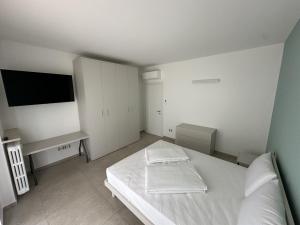 Ένα ή περισσότερα κρεβάτια σε δωμάτιο στο Appartamento Deluxe Fronte Ospedale +18 φωτογραφίες