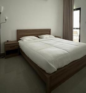 Postel nebo postele na pokoji v ubytování Cozy Apartment in Boshar