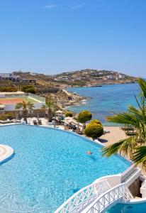 a swimming pool with a view of the ocean at Saint John Hotel Villas & Spa in Agios Ioannis Mykonos