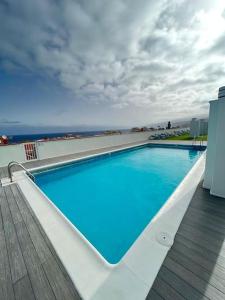 a large swimming pool on top of a building at Girasol Rooftop View in Puerto de la Cruz