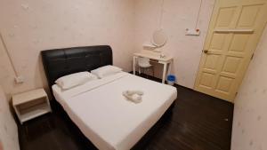 Postel nebo postele na pokoji v ubytování Jade Guesthouse Jonker Melaka