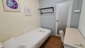 Postel nebo postele na pokoji v ubytování Jade Guesthouse Jonker Melaka