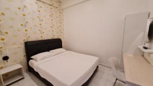 Postel nebo postele na pokoji v ubytování Jade Guesthouse Jonker Melaka