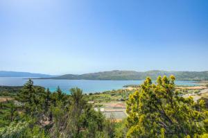 a view of a lake with mountains in the background at VILLA MARIA - CAPO D'ORSO - HOME and MORE in Palau