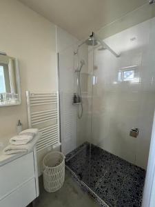 a white bathroom with a shower and a sink at Apartment 4 confort&modern in Arad +29 photos