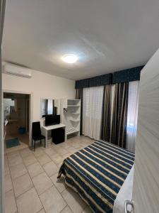 Posteľ alebo postele v izbe v ubytovaní Hotel Alessander