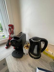 a coffee maker and a mixer in a room at appartement 65m in Châtillon