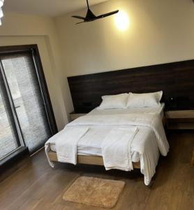 Posteľ alebo postele v izbe v ubytovaní ANT Biz Rooms Near Chennai Trade Centre