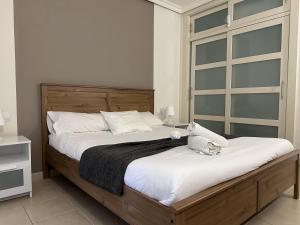 En eller flere senge i et værelse på MarketHome Balcon de los Gigantes B09 + 20 billeder