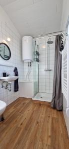 a bathroom with a shower and a sink at Hagi 2 Road 62 nr 2 in Hagi