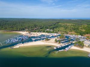 an aerial view of a marina with boats in the water at Maison climatisée à Parentis-en-Born, 3 chambres, jardin, proche centre et activités, ménage inclus - FR-1-319-554 in Parentis-en-Born
