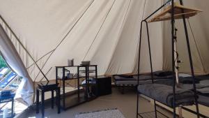 a room with two beds in a tent at Glamping-Dimbo in Krynica Zdrój