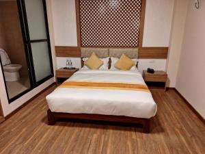 Vuode tai vuoteita majoituspaikassa Hotel Himalayan Villa