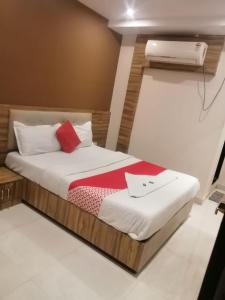 Postel nebo postele na pokoji v ubytování Ruby Hotel