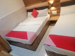 Postel nebo postele na pokoji v ubytování Ruby Hotel