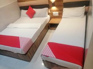 Postel nebo postele na pokoji v ubytování Ruby Hotel