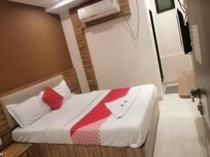 Postel nebo postele na pokoji v ubytování Ruby Hotel