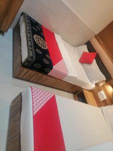Postel nebo postele na pokoji v ubytování Ruby Hotel