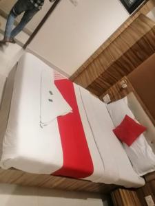 Postel nebo postele na pokoji v ubytování Ruby Hotel