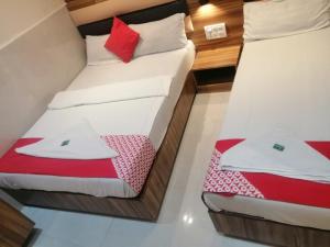 Postel nebo postele na pokoji v ubytování Ruby Hotel