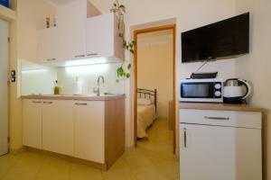 Kuchyň nebo kuchyňský kout v ubytování Uliveto Apartment