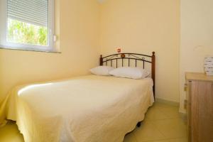 Postel nebo postele na pokoji v ubytování Uliveto Apartment