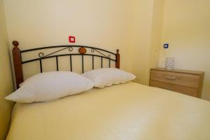 Postel nebo postele na pokoji v ubytování Uliveto Apartment