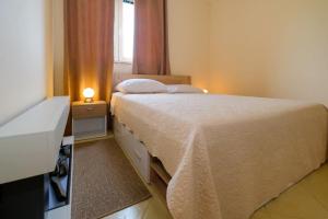 Postel nebo postele na pokoji v ubytování Uliveto Apartment + 37 fotografií