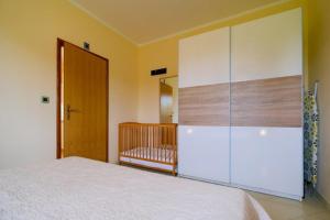 Postel nebo postele na pokoji v ubytování Uliveto Apartment